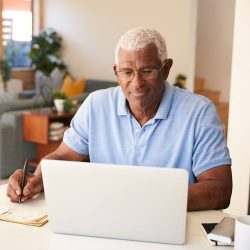 Senior African American Man Using Laptop