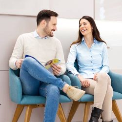 Young couple sitting in Waiting room